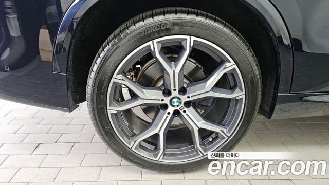 BMW X5 2022 — ფოტო 4/20