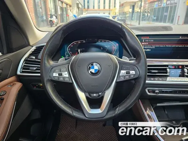 BMW X5 2022 — ფოტო 7/20