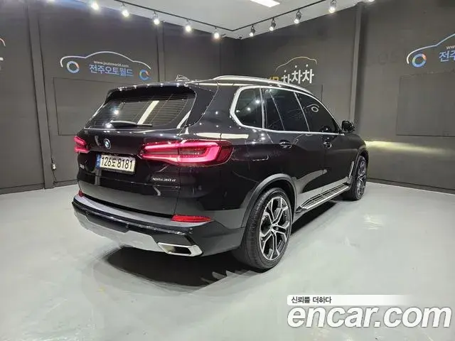 BMW X5 2022 — Фото 1/20
