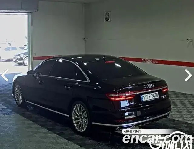 Audi A8 2021 — Фото 4/18