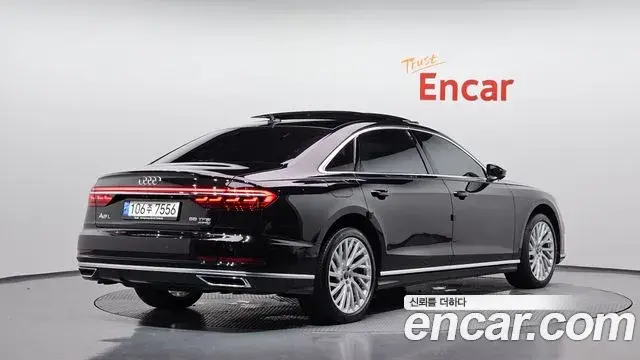 Audi A8 2021 — Фото 2/20