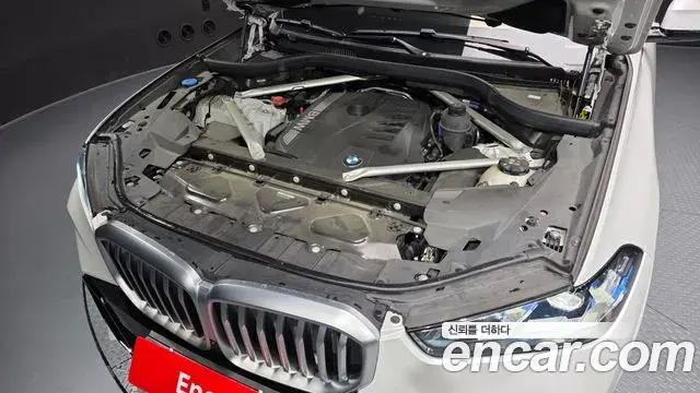 BMW X5 2023 — ფოტო 14/34