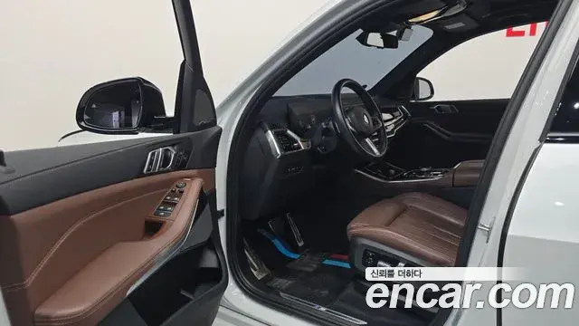 BMW X5 2023 — ფოტო 25/32