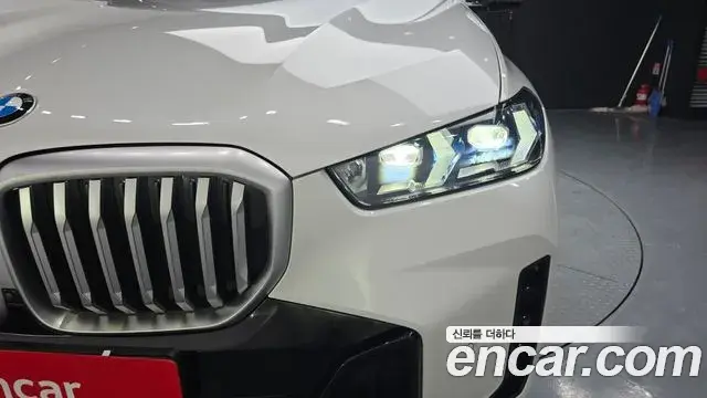 BMW X5 2023 — ფოტო 24/32