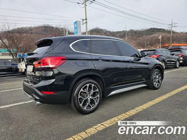 BMW X1 2021 — ფოტო 1/20