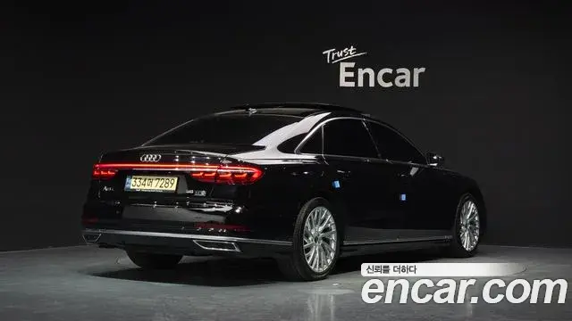 Audi A8 2021 — Фото 2/20