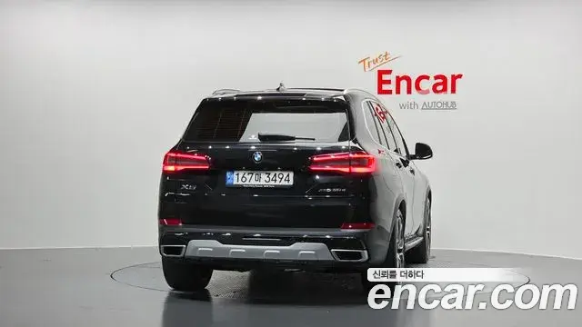 BMW X5 2022 — ფოტო 7/20