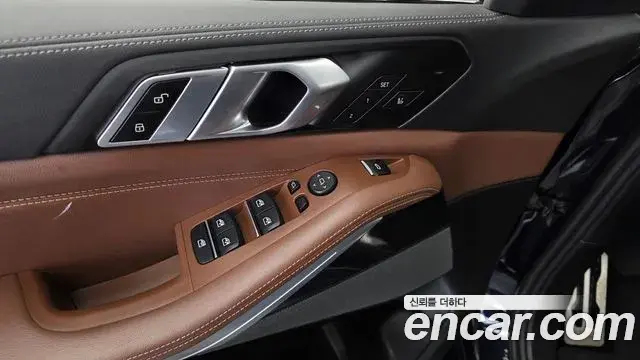 BMW X5 2023 — ფოტო 28/33