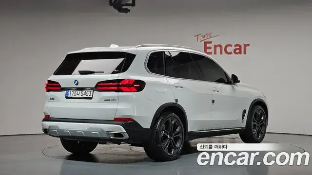 BMW X5 2024 — ფოტო 11/34